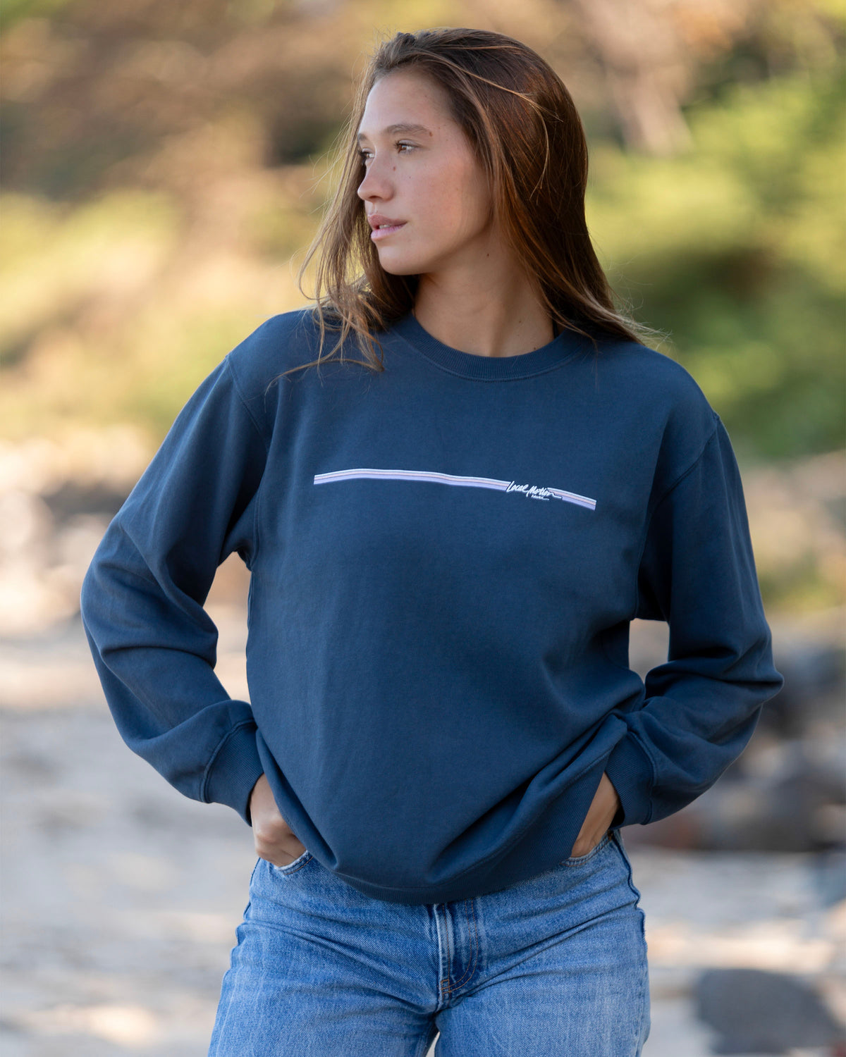 Woman in long sleeve blue sweater 