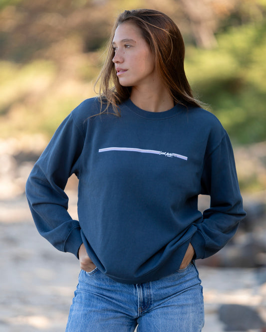 Woman in long sleeve blue sweater 
