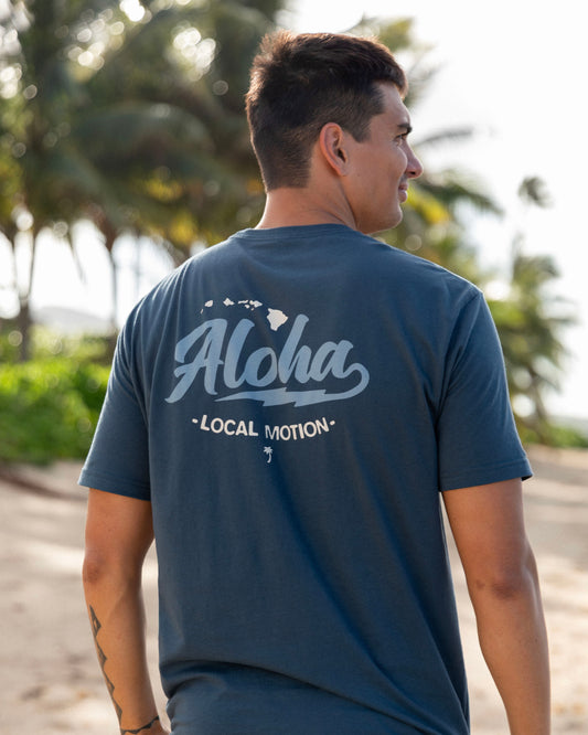 A man wearing a navy blue t-shirt with a white graphic print on the back [indigo]