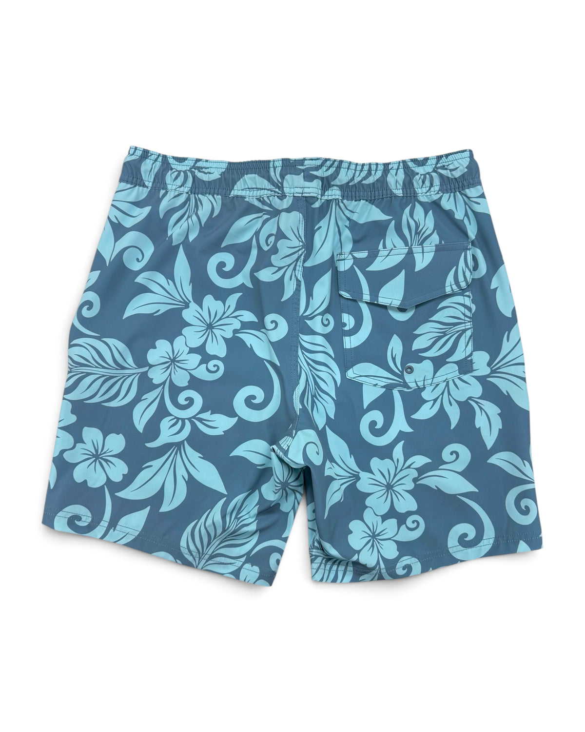 Blue and light blue tropical floral print swim trunks with a matching elastic waistband, photographed flat on a white background. [pacific blue]
