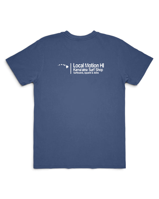 A blue short-sleeve t-shirt with a white printed graphic on the left chest reading 'Local Motion HI Kama'aina Surf Shop Surfboards, Apparel & More' on a plain white background. [vintage blue]