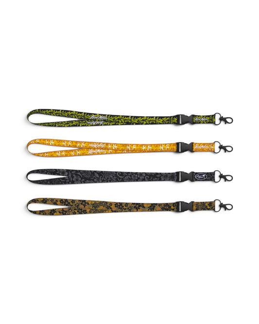 lanyards flat in a row in various colors [puakenikeni] [pua'ena][maile][woodland camo]
