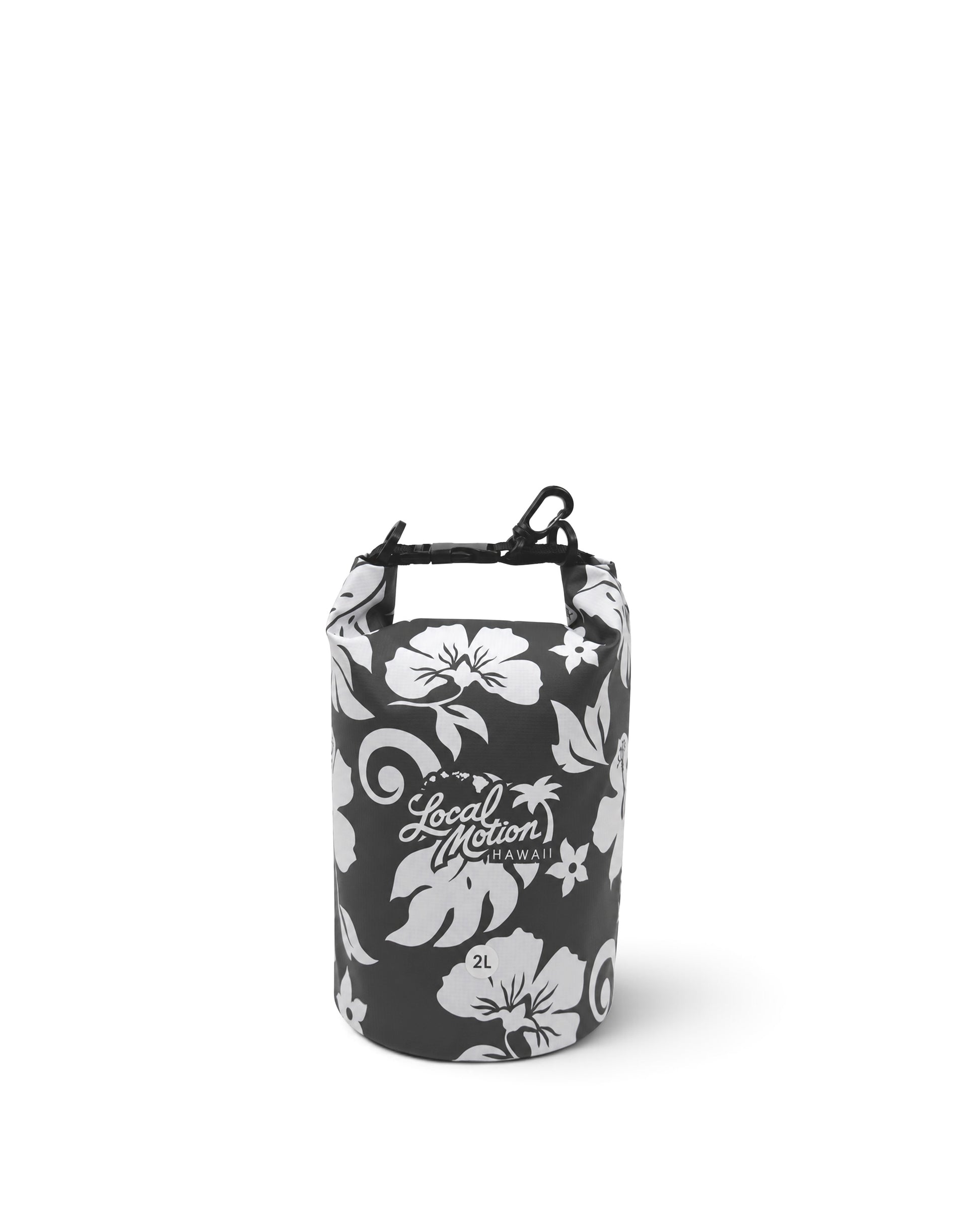 A dry bag with a black and white floral pattern, featuring the 'Local Motion' brand logo on the front, set against a plain white background. [black/cool grey]