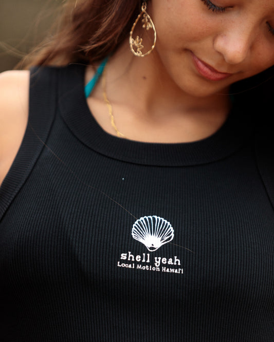 Close-up of a woman wearing a black ribbed tank top [black]