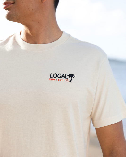 A shot of a t-shirt up close with Local Motion logo [parchment]